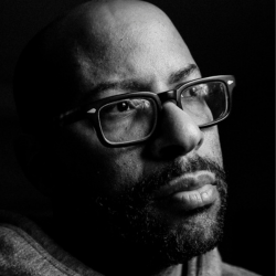 Headshot of man with glasses