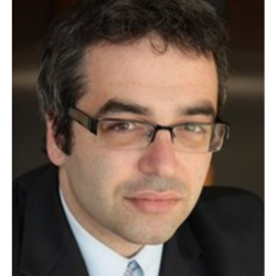 Headshot of a man with glasses